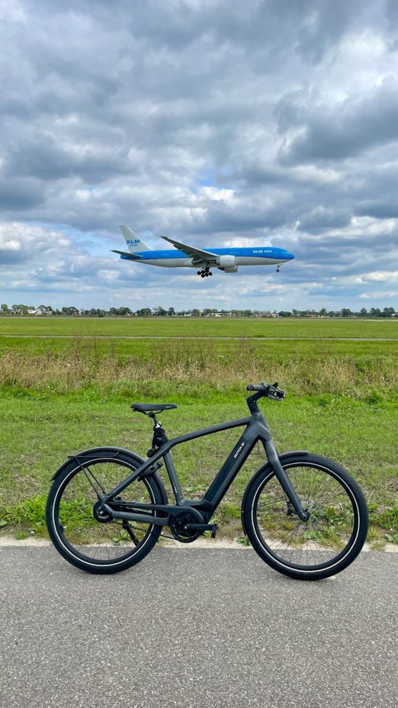 black-bicycle-with-airplane-in-the-background-31156125